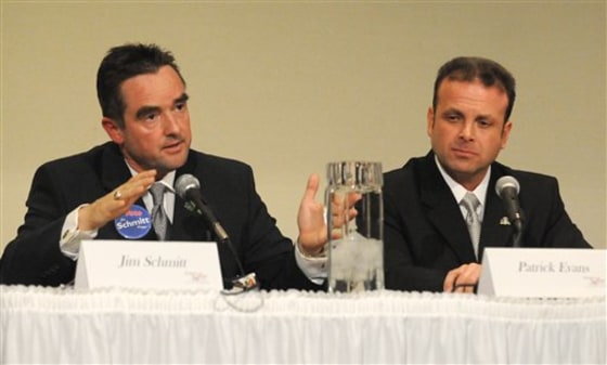 Green Bay, Wis., mayoral candidates Jim Schmitt, left, and Patrick Evans debating at the Brown County Central Library on March 30.